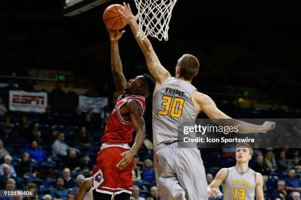 Northern Illinois Huskies guard Eugene German goes in for a layup against Toledo Rockets forward Luke Knapke during the second half of a regular...