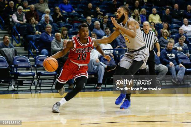 Northern Illinois Huskies guard Eugene German drives to the basket against Toledo Rockets guard Tre'Shaun Fletcher during the second half of a...