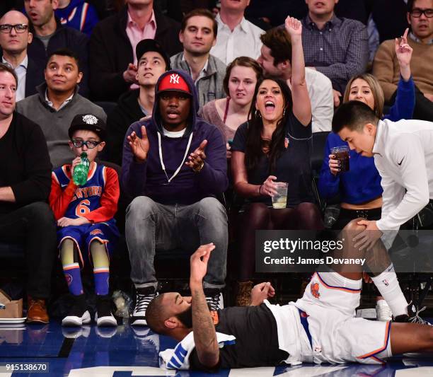 Michael Che and Cecily Strong attend the New York Knicks vs Milwaukee Bucks game at Madison Square Garden on February 6, 2018 in New York City.