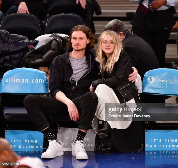 Henry Frye and Dakota Fanning attend the New York Knicks vs Milwaukee Bucks game at Madison Square Garden on February 6, 2018 in New York City.