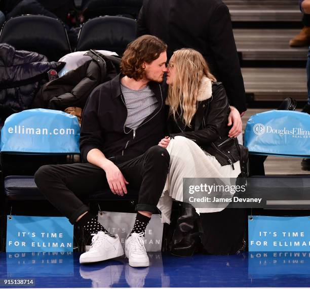 Henry Frye and Dakota Fanning attend the New York Knicks vs Milwaukee Bucks game at Madison Square Garden on February 6, 2018 in New York City.