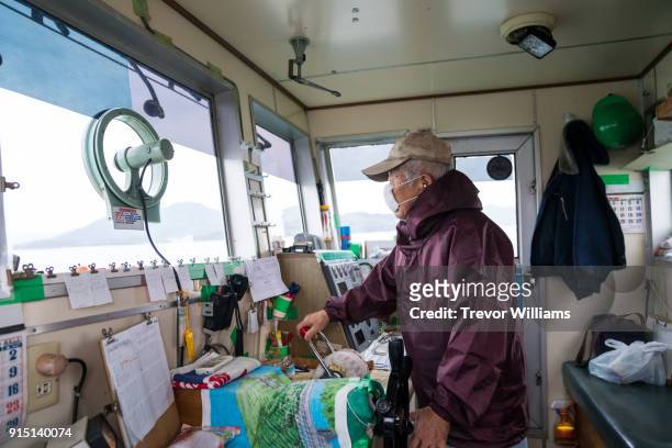 a senior boat captain driving a tugboat - barge stock pictures, royalty-free photos & images