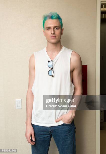 Poses backstage at the Perry Ellis fashion show during New York Fashion Week Mens' at The Hippodrome Building on February 6, 2018 in New York City.