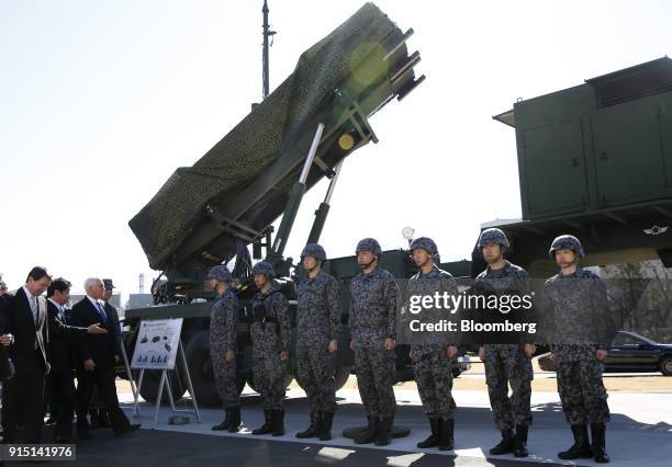 Vice President Mike Pence, third from left, inspects a Japan's self-defense force Patriot Advanced Capability-3 missile interceptor, manufactured by...