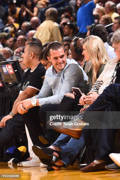 Derek Carr looks on from court side during the game between the Golden State Warriors and the Oklahoma City Thunder on February 6, 2018 at ORACLE...