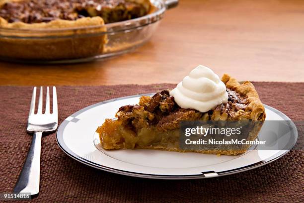 slice of pecan pie with cream - pecan pie stock pictures, royalty-free photos & images