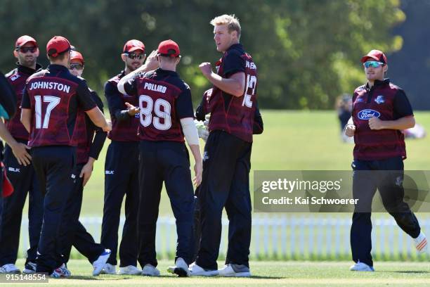 Kyle Jamieson of Canterbury is congratulated by team mates after dismissing Glenn Phillips of the Auckland Aces during the One Day Ford Trophy Cup...