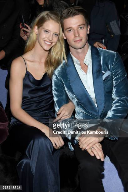 Abby Champion and Patrick Schwarzenegger attend the Tom Ford Fall/Winter 2018 Men's Runway Show at the Park Avenue Armory on February 6, 2018 in New...