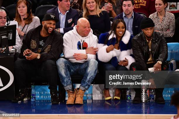 Sabathia, guest, Remy Ma and Papoose attend the New York Knicks vs Milwaukee Bucks game at Madison Square Garden on February 6, 2018 in New York City.
