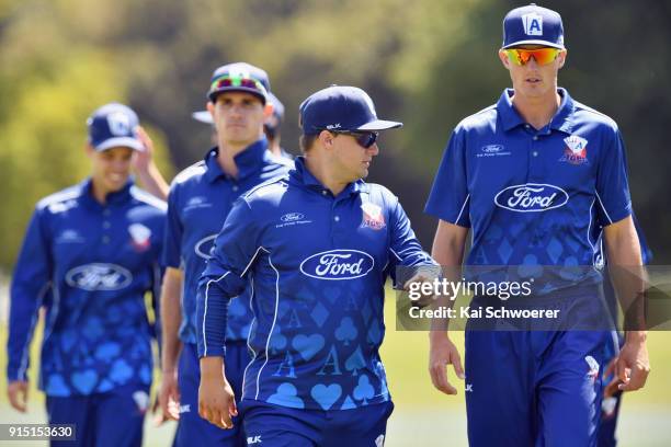 Captain Craig Cachopa of the Auckland Aces and his team mates walk from the ground at the lunch break during the One Day Ford Trophy Cup match...