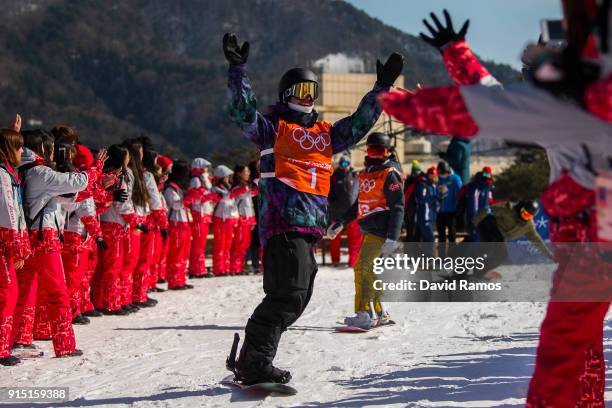 Olympic volunteers cheer the snowboard rider Mans Hedberg in action during a slope style training session ahead of the PyeongChang 2018 Winter...