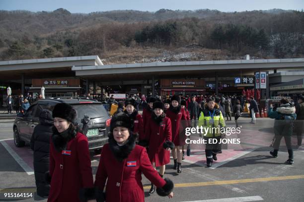 North Korean cheerleaders arrive at a rest stop, or service station, as their bus convoy carrying a 280-member delegation on its way to the 2018...