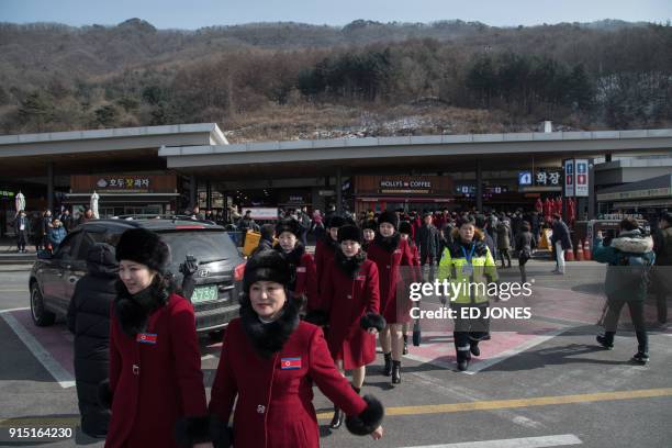 North Korean cheerleaders arrive at a rest stop, or service station, as their bus convoy carrying a 280-member delegation on its way to the 2018...