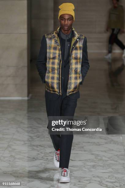 Model walks the runway wearing Perry Ellis Fall 2018 at The Hippodrome Building on February 6, 2018 in New York City.