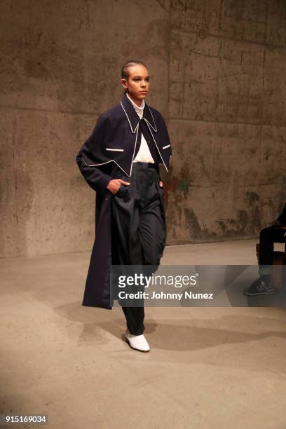 Model walks the runway during the Carlos Campos - February 2018 - New York Fashion Week Mens' presentation at Skylight Modern on February 6, 2018 in...