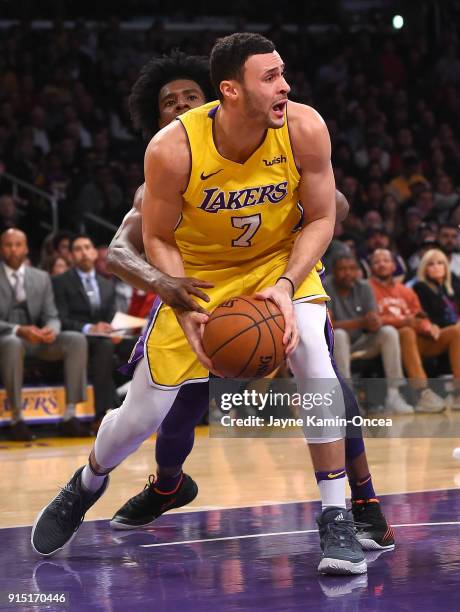 Josh Jackson of the Phoenix Suns guards Larry Nance Jr. #7 of the Los Angeles Lakers as he looks to pass the ball under the basket in the second half...