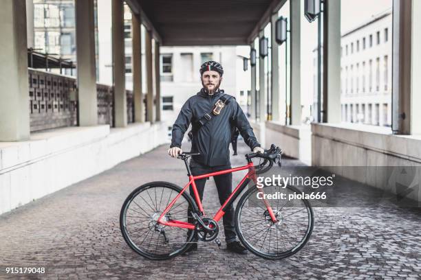 portrait of a bicycle messenger commuter - action movie stock pictures, royalty-free photos & images