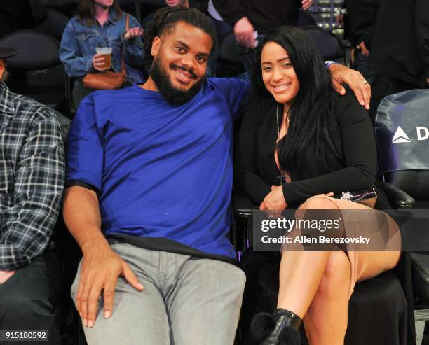 Professional baseball player Kenley Jansen and wife Gianni Jansen attend a basketball game between the Los Angeles Lakers and the Phoenix Suns at...