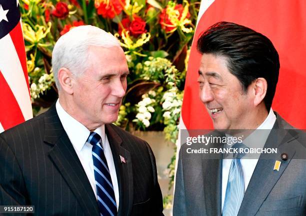 Vice President Mike Pence is welcomed by Japan's Prime Minister Shinzo Abe upon his arrival at the prime minister's official residence in Tokyo on...