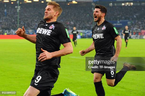 Simon Terodde of Koeln celebrates after scoring his team`s second goal with Milos Jojic of Koeln during the Bundesliga match between Hamburger SV and...