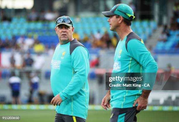 Australian head coach Darren Lehmann talks to Australian assistant coach Ricky Ponting during the Twenty20 International match between Australia and...