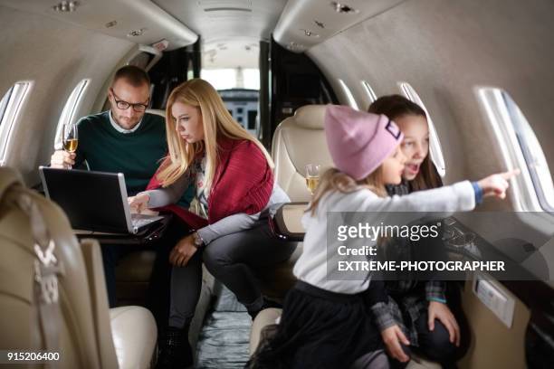 familie im flugzeug - luxury family stock-fotos und bilder