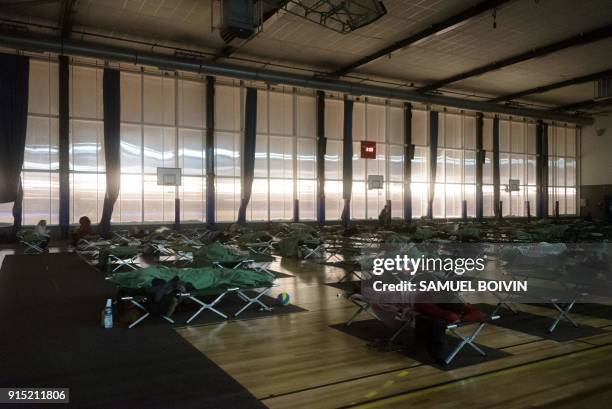 People who were stranded by the snow on the road, rest in an emergency shelter installed at the Robert Wagner gymnasium in Velizy-Villacoublay,...