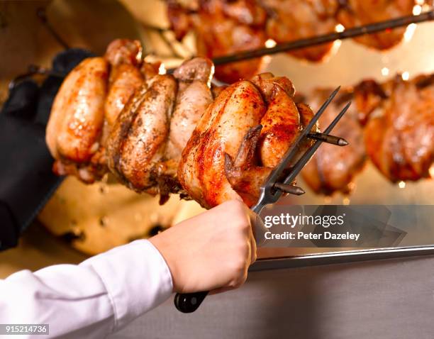 rotisserie chicken being cooked - rotisserie stock pictures, royalty-free photos & images