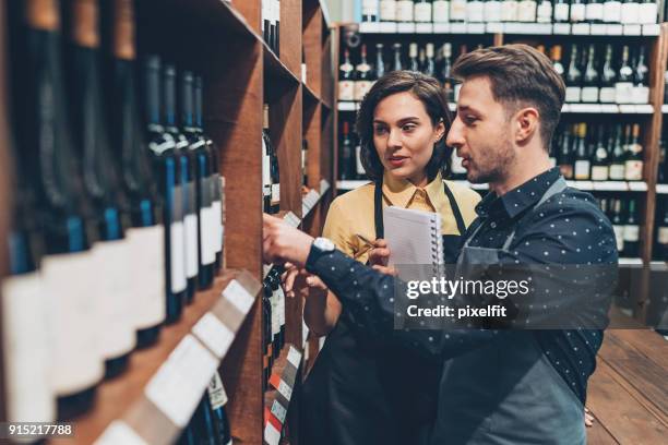 arranging and labeling of the new wine bottles - labeling stock pictures, royalty-free photos & images