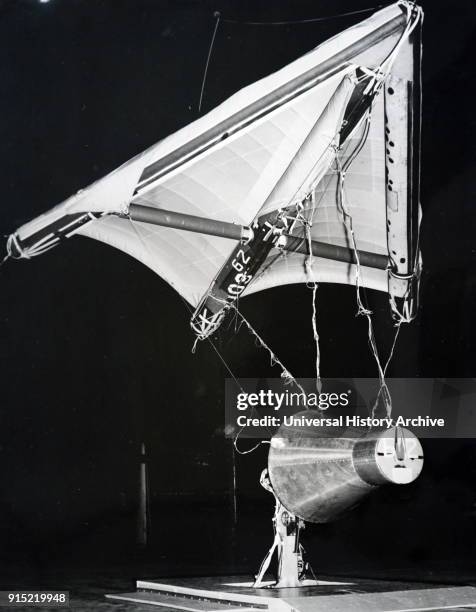 Photograph of a half scale model of the Gemini 1 space capsule. Gemini 1 was the first unmanned test flight of the Gemini spacecraft in NASA's Gemini...