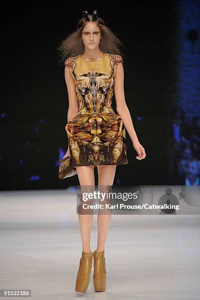 Model walks the runway during the Alexander McQueen Ready To Wear show as part of the Paris Womenswear Fashion Week Spring/Summer 2010 at Salle...