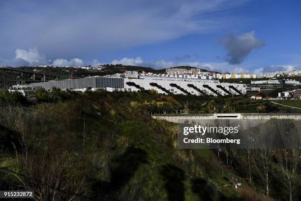 Residential properties sit on the skyline beyond the Dolce Vita Tejo shopping mall, operated by AXA Real Estate Investment Managers SGR SpA, in...