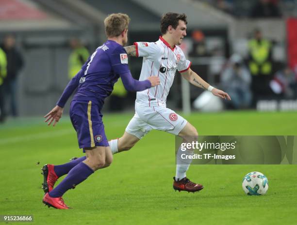 Benito Raman of Duesseldorf and Pascal Koepke of Aue battle for the ball during the Second Bundesliga match between Fortuna Duesseldorf and FC...