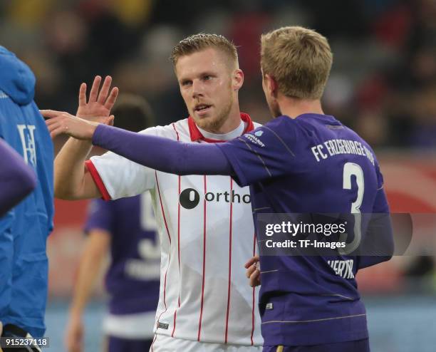 Sebastian Hertner of Aue and Rouven Hennings of Duesseldorf gesture during the Second Bundesliga match between Fortuna Duesseldorf and FC Erzgebirge...