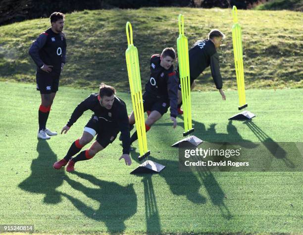 Danny Care , Richard Wigglesworth and Harry Mallinder take part in sprint training during the England training session held at Pennyhill Park on...