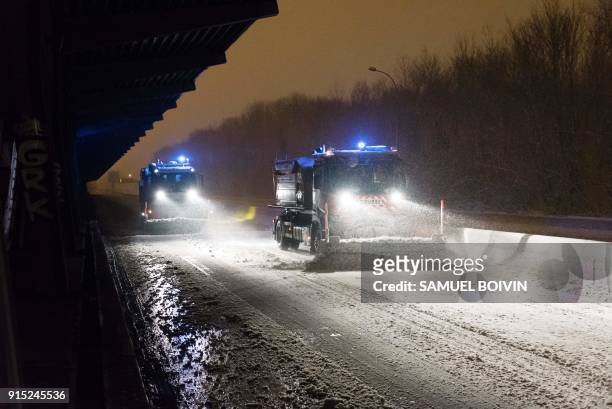 Snowplough clears the snow from the snow-covered N118 main road near Velizy-Villacoublay early February 7, 2018 after its closure following heavy...