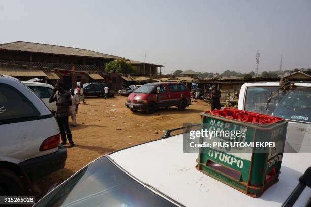 This photograph taken on February 3 shows a crate - which rests on the roof of the minibus - indicating its destination at Gboko bus station in the...