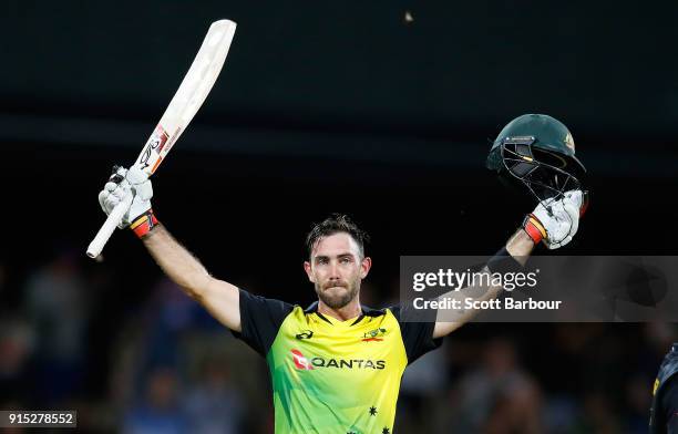 Glenn Maxwell of Australia celebrates his century after hitting a six from the last ball during the Twenty20 International match between Australia...