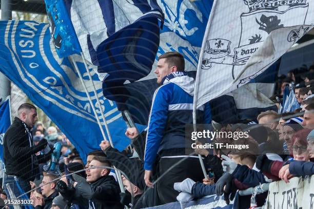 Suporters of Darmstadt are seen with flags during the Second Bundesliga match between SV Darmstadt 98 and MSV Duisburg at Merck-Stadion am...