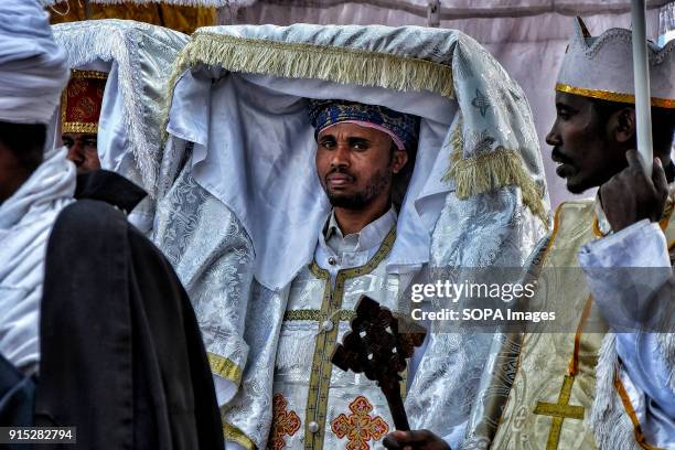 Orthodox priests carry a tabot, a model of the Ark of the Covenant, on a procession through Gondar. The annual Timkat festival, an Orthodox Christian...