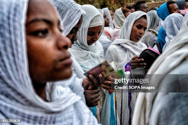 Women praying at the Fasilides Bath. The annual Timkat festival, an Orthodox Christian celebration of Epiphany, remembers the baptism of Jesus in the...