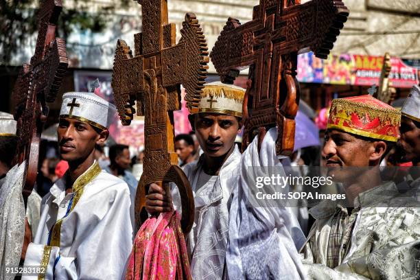 Young Ethiopian Orthodox Christians pray during the procession. The annual Timkat festival, an Orthodox Christian celebration of Epiphany, remembers...