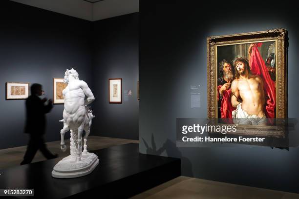 Visitor passes the roman Centauer and the Ecco Homo picture during the 'Rubens - Kraft der Verwandlung' exhibition preview at Staedel Museum on...