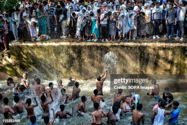 Pilgrims bathing in the waters of the Fasilides Baths. The annual Timkat festival, an Orthodox Christian celebration of Epiphany, remembers the...