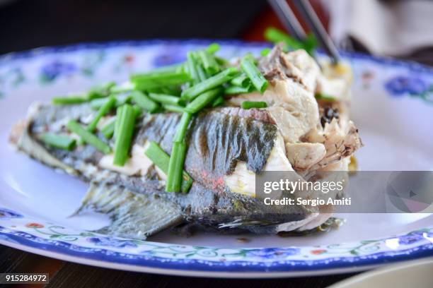 steamed bluefin trevally with spring onions - bluefin trevally stock pictures, royalty-free photos & images