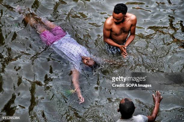 Pilgrims bathing in the blessed waters of the Fasilides Baths. The annual Timkat festival, an Orthodox Christian celebration of Epiphany, remembers...