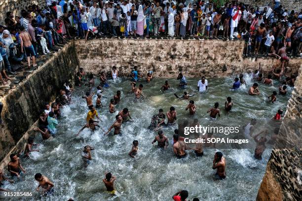 Pilgrims bathing in the waters of the Fasilides Baths. The annual Timkat festival, an Orthodox Christian celebration of Epiphany, remembers the...