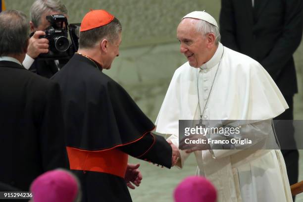 Pope Francis greets archbishop of Chicago cardinal Blase Joseph Cupich at the Paul VI Hall during his weekly audience on February 7, 2018 in Vatican...