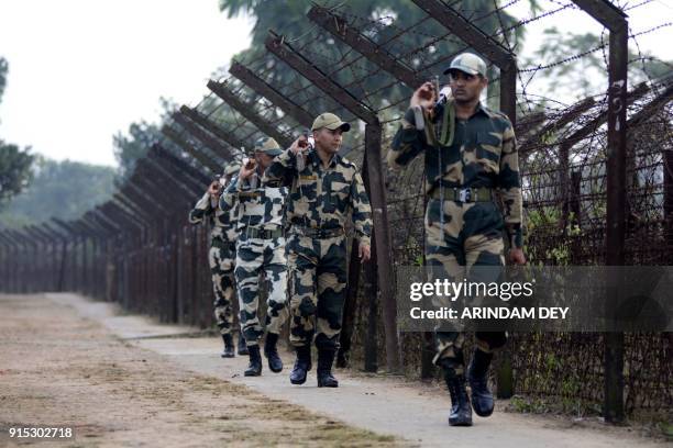Indian Border Security Force personnel patrol along the India-Bangladesh border on the eve of Prime Minister Narendra Modi's political rally ahead of...