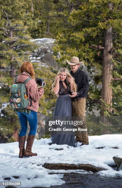 Couple takes their engagement photos at Eagle Falls, located above scenic Emeral Bay, on January 22 in South Lake Tahoe, California. Though a...